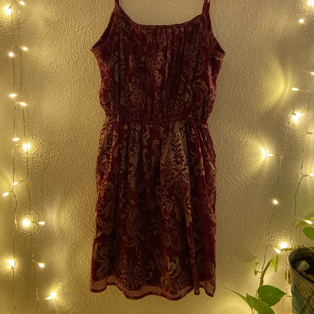 red dress with gold flower detail